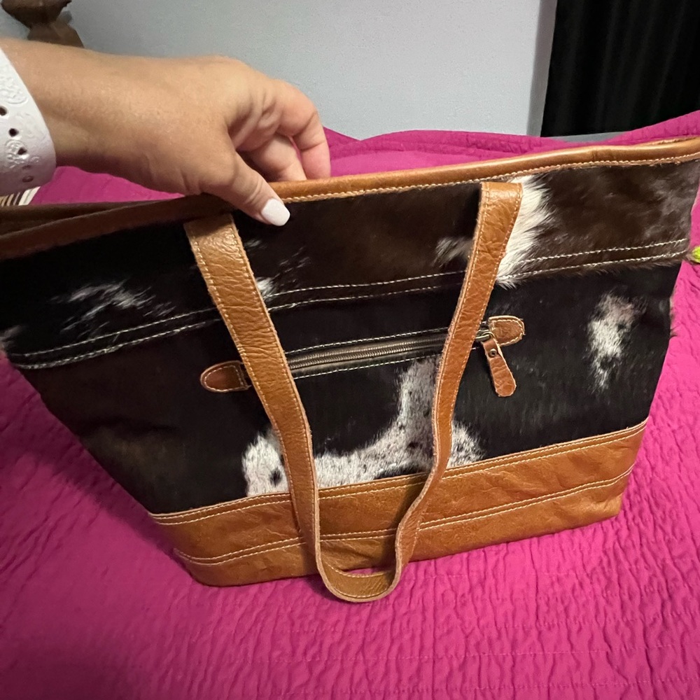 Myra cowhide bag with small bag for inside.    New never used either.